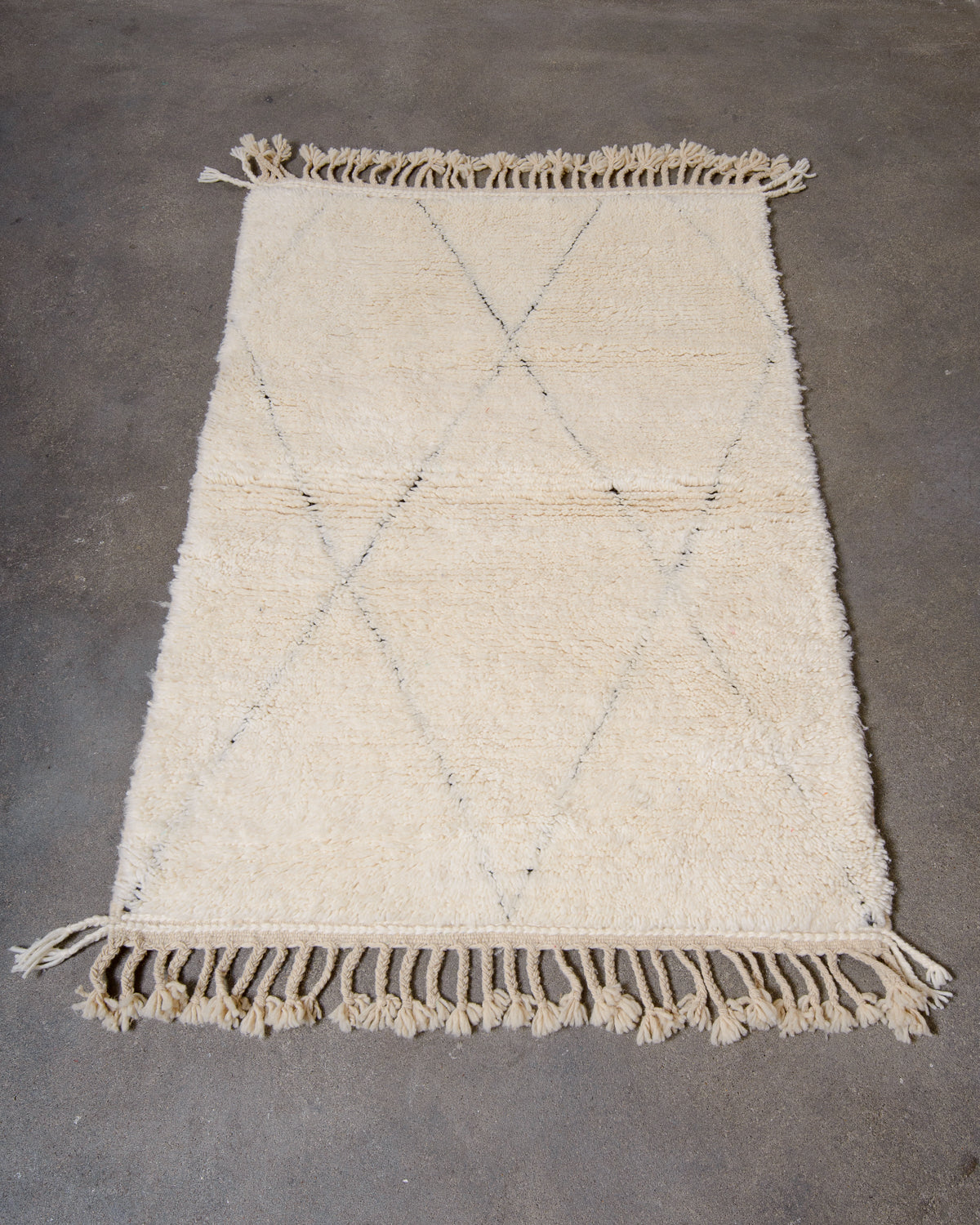 Modern, designer, handcrafted Berber rug from Morocco. Beniourain carpet with minimalist design, natural wool pile and a fluffy texture.